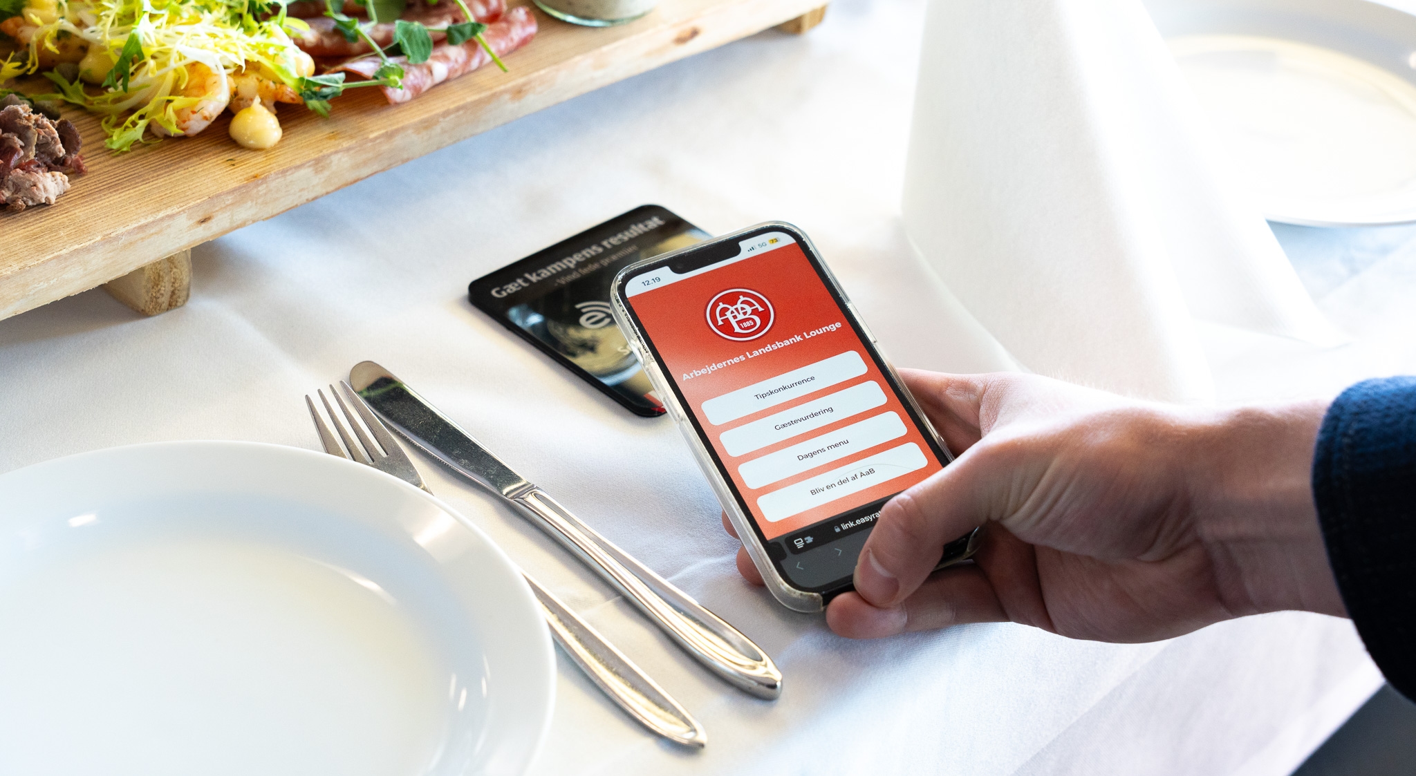 AaB guest with the menu open on their phone after tapping the stand